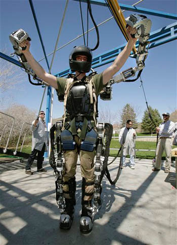 Software engineer Rex Jameson stretches in a robotic soldier suit being made for
the U.S. Army by Raytheon on Monday, April 14, 2008, in Salt Lake City. The suit
can multiply its wearer's strength and endurance as many as 20 times, with
relatively little loss of agility, by sensing and almost instantly amplifying...